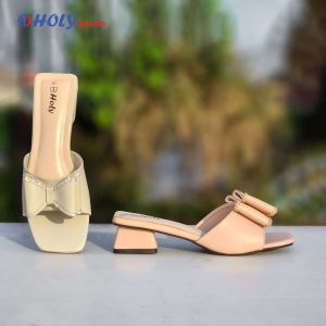 Women’s block heel sandals in cream and peach with elegant bow design from Holy Brand
